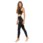 Modèle avec legging Floky Hyper noir femme technique avec compression ciblée soutien musculaire et confort pour la pratique sportive intense
